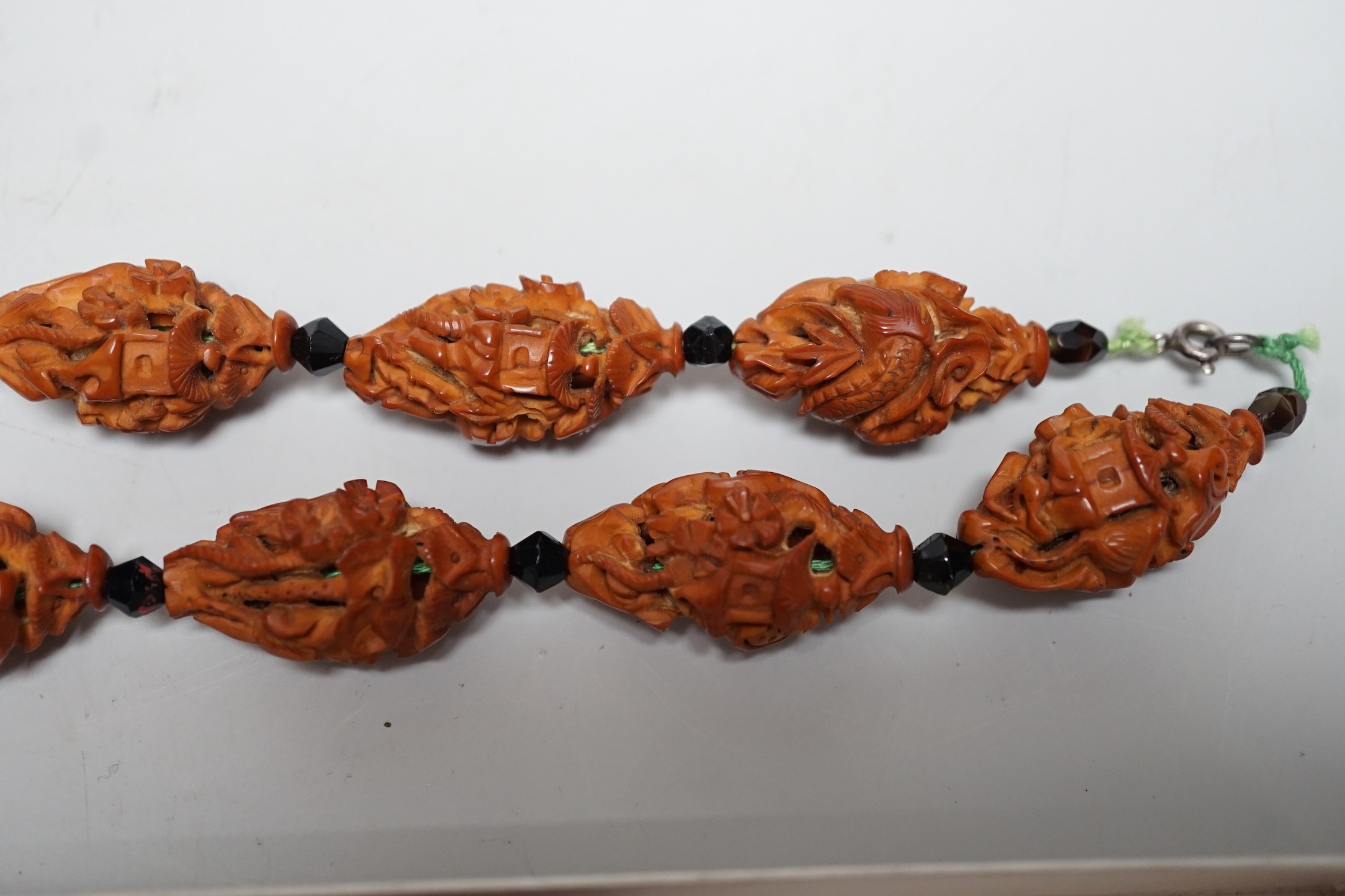A collection of Chinese carved peach stones, early 20th century